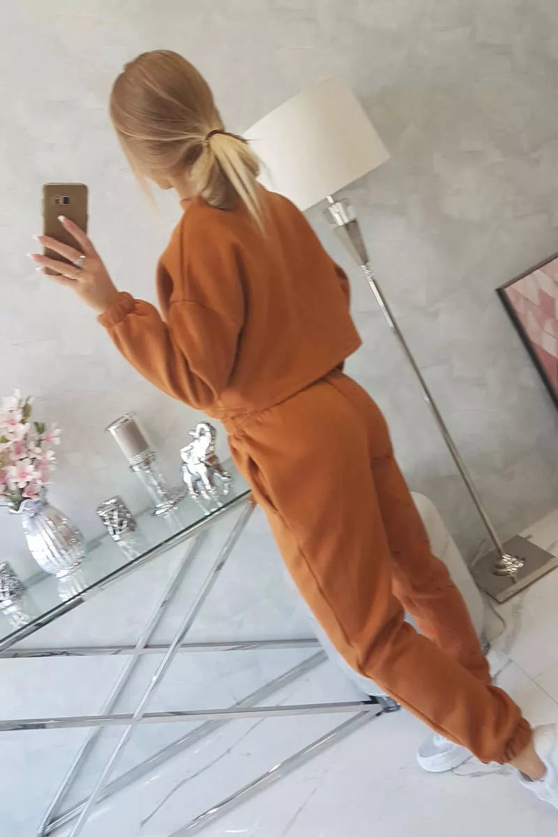 Sieviešu komplekts Splash, spilgti brūnā krāsā.